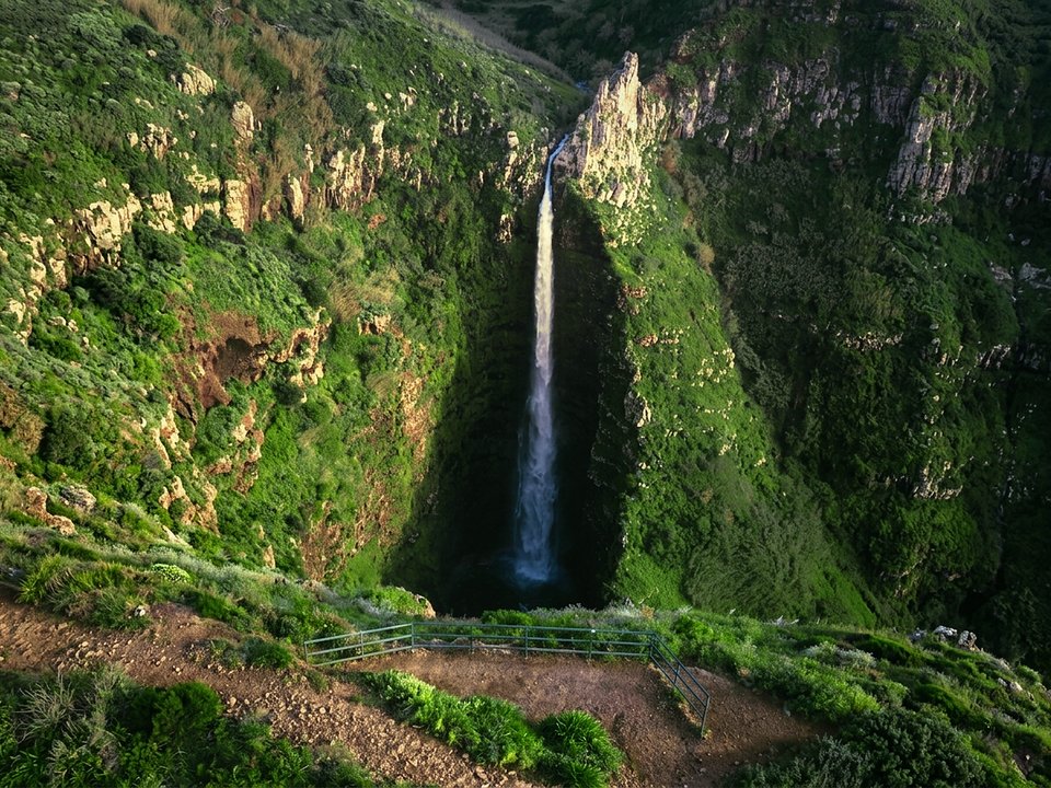 Dramatic ocean cliffs and coastal trail near Ponta do Pargo on the approach to Garganta Funda