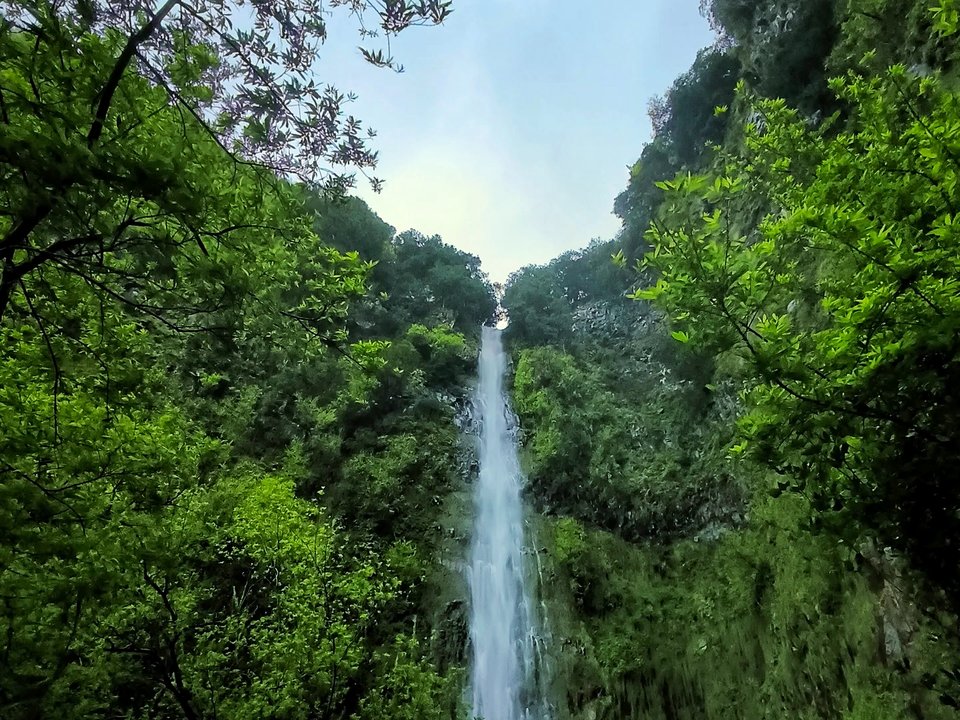Hidden cascade pool and soaring canyon waterfall at Cascata de Água d'Alto in São Vicente