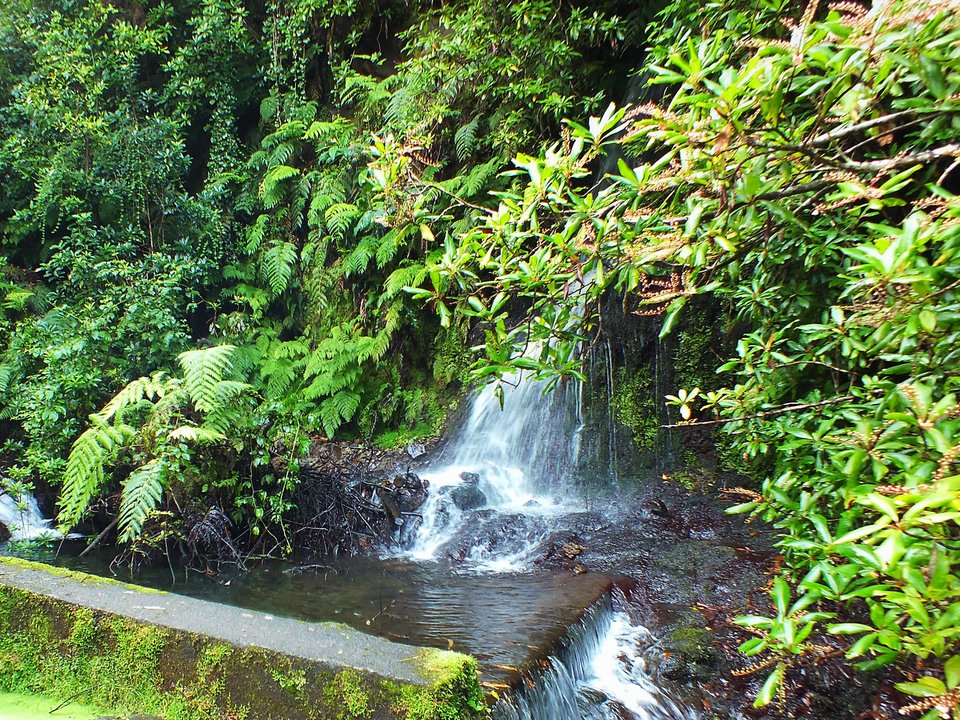 Masonry water channel and inspection path of Levada da Achada Grande near Ribeira dos Moinhos in São Vicente