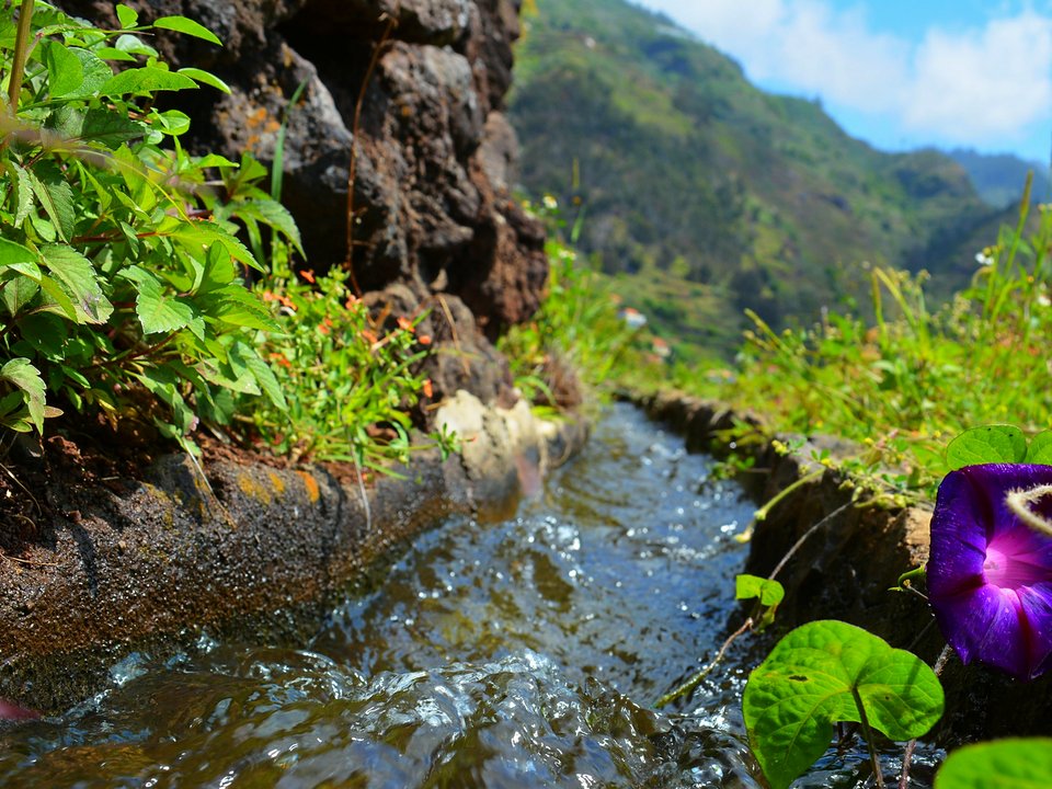 Masonry water channel and inspection path of Levada das Voltas near Sítio da Terça da Ribeira da Tabua in Ribeira Brava