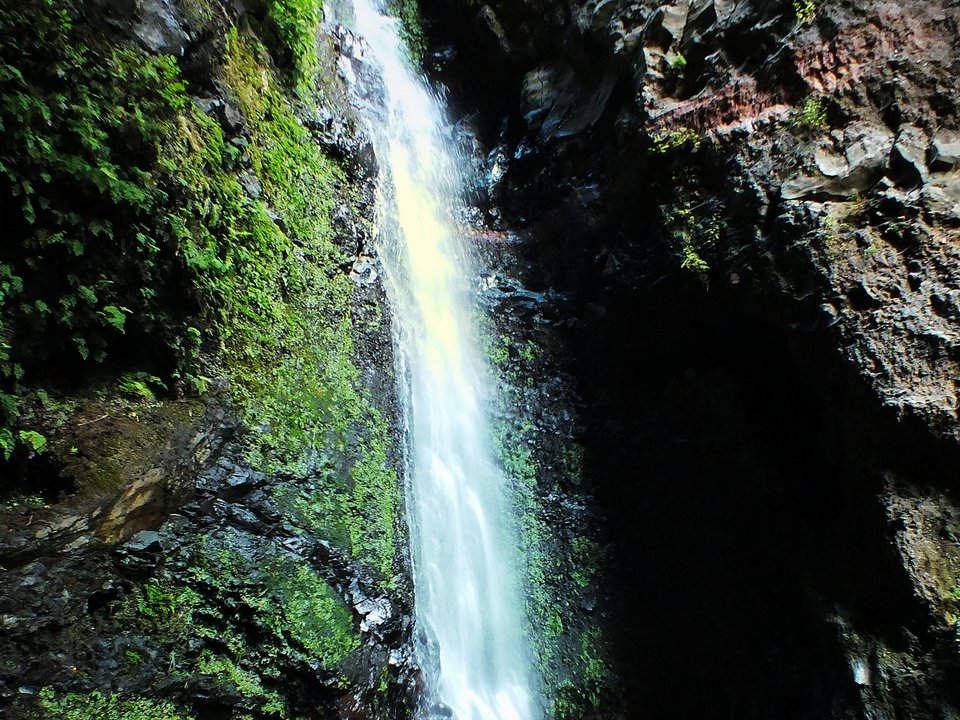 Masonry water channel and inspection path of Levada do Bom Sucesso near Ribeira de João Gomes in Funchal