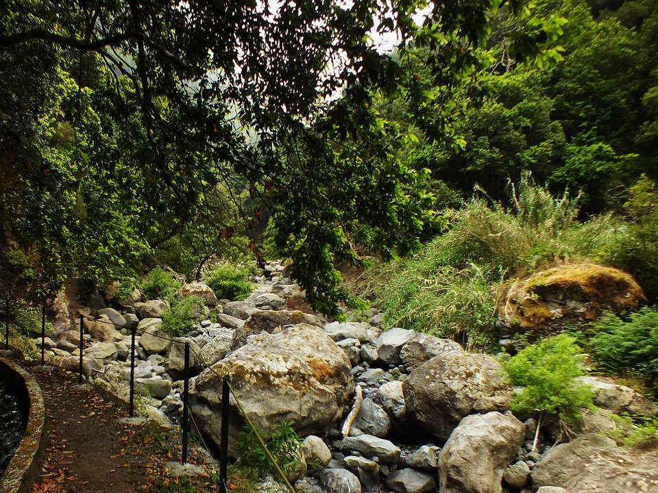 Masonry water channel and inspection path of Levada do Castelejo near Ribeira de São Roque do Faial in Machico