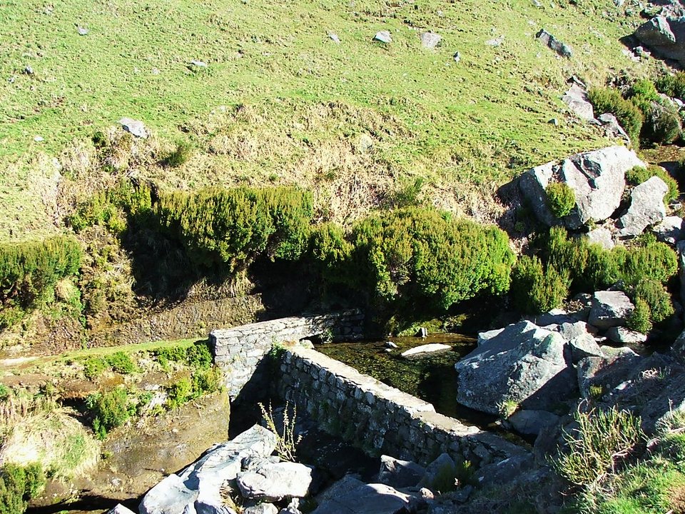 Masonry water channel and inspection path of Levada do Paul near Fonte do Juncal / Ribeira da Ponta do Sol in Calheta