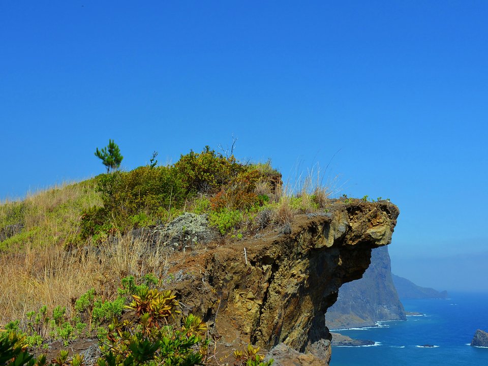 View over Praia da Maiata and the parish center of Porto da Cruz, framed by Penha d'Águia