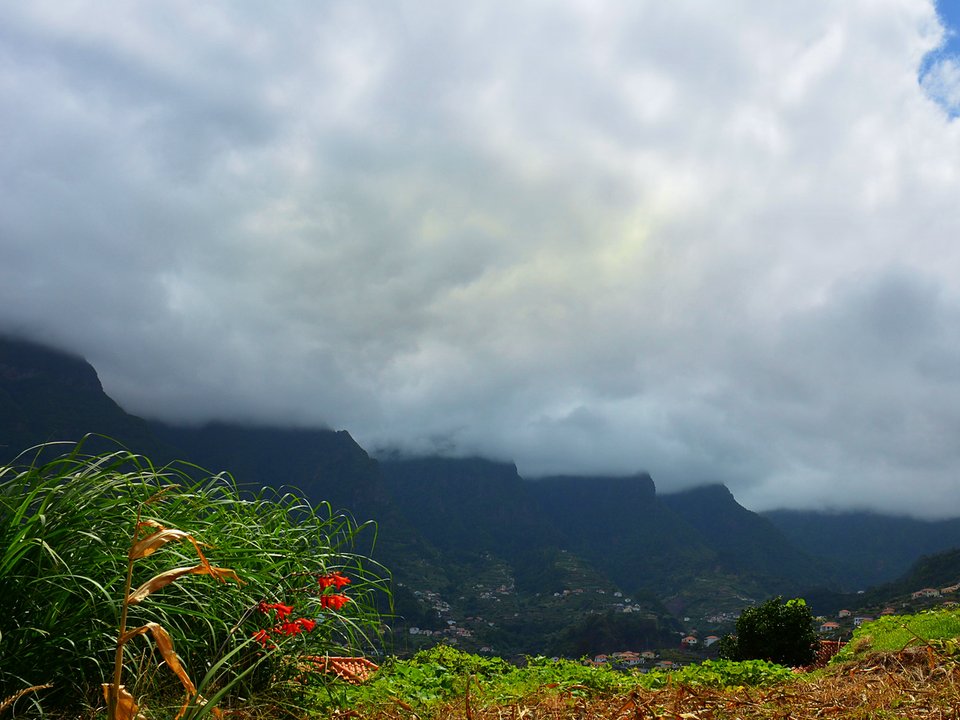 View across the São Vicente valley from the Levada do Vimieiro terrace bench