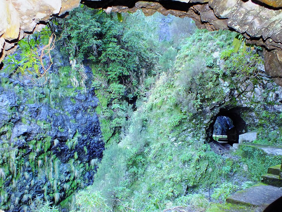 Masonry water channel and inspection path of Levada Nova do Juncal near Ribeira do Juncal in Santana
