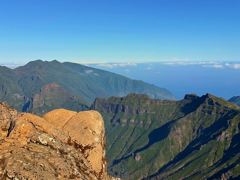 Colossal volcanic dome of Pico Grande looming above the Boca da Corrida mountain trail
