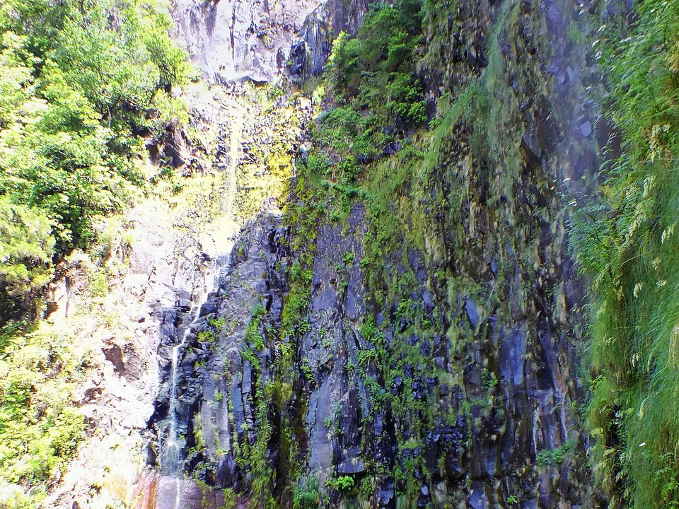 Rabaçal gorge view showing the semicircular Cascata do Risco balcony and cliff-cut levada bench