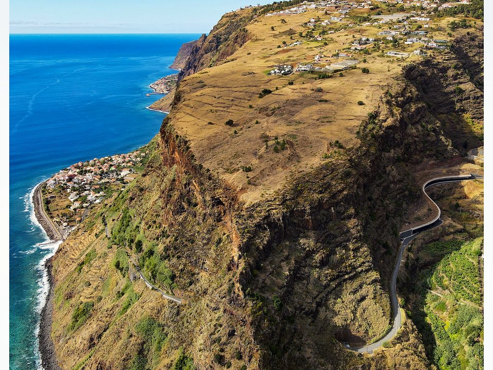 Sweeping Atlantic horizon and coastal headlands viewed from the cliff path in Calheta