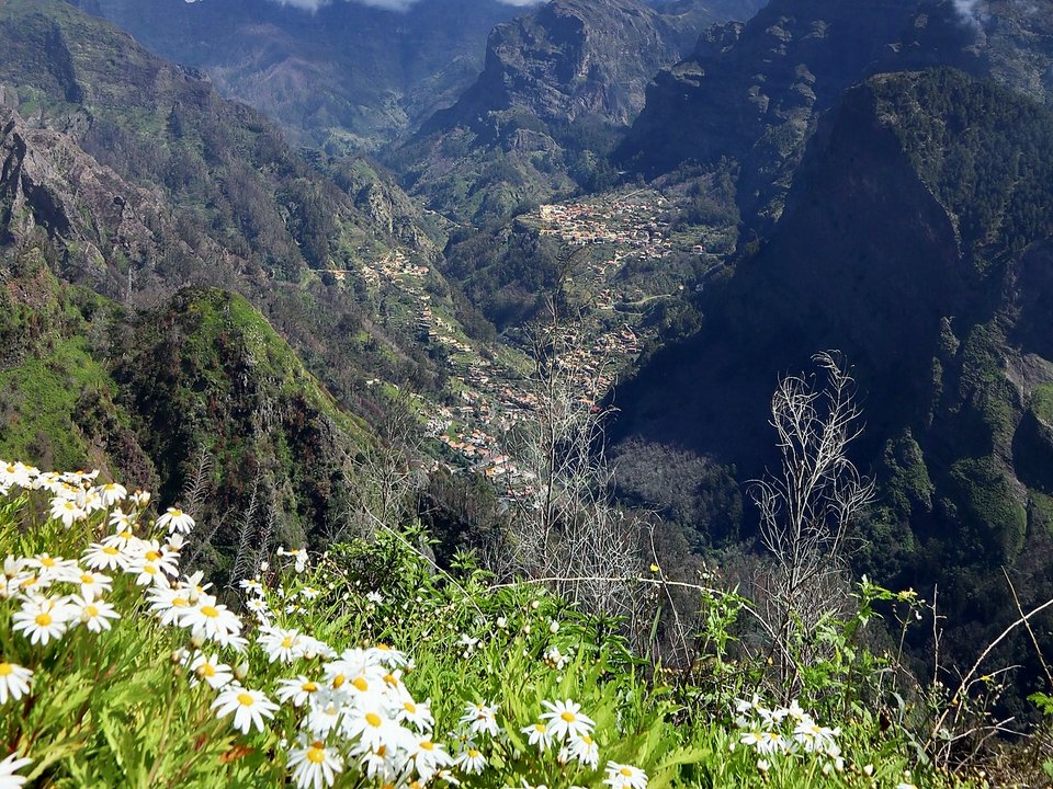 Panoramic mountain viewpoint looking down into the crater valley of Curral das Freiras