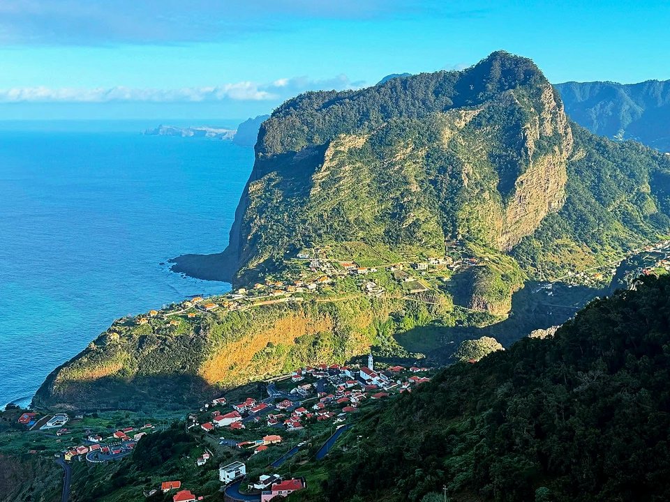 Rugged summit ascent of the iconic monolith Penha d'Águia towering over Porto da Cruz