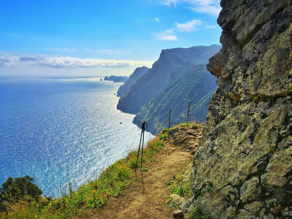 Breathtaking cliffside footpath carved into the coastal precipice along Vereda do Larano