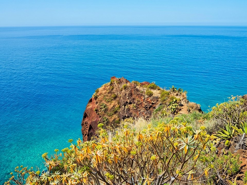 Exhilarating cliff descent over the crashing Atlantic waves at Pesqueiro